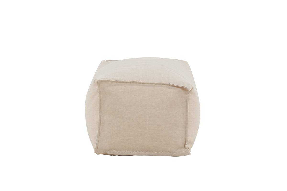 Neutral beige fabric pouf with a square base and slightly rounded top edges, designed for versatile seating or footrest use in modern living spaces. | PicSEO 1773145182543