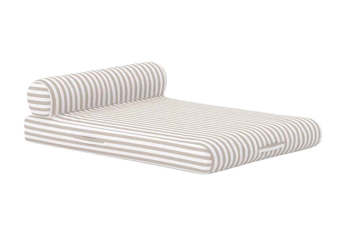 Modern outdoor lounge mattress featuring beige and white horizontal stripes, designed for comfort with a cylindrical bolster pillow. Its low-profile, cushioned base provides a stylish and relaxing seating or reclining option for patios, poolsides, or garden spaces. | PicSEO 1773144995873