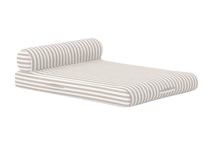 Modern outdoor lounge mattress featuring beige and white horizontal stripes, designed for comfort with a cylindrical bolster pillow. Its low-profile, cushioned base provides a stylish and relaxing seating or reclining option for patios, poolsides, or garden spaces. | PicSEO 1773144995873