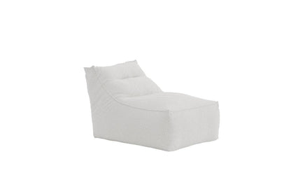 Modern white textured lounge chair with a plush, curved design, featuring a padded backrest and cushioned seat for enhanced comfort and contemporary style. | PicSEO 1773145288105