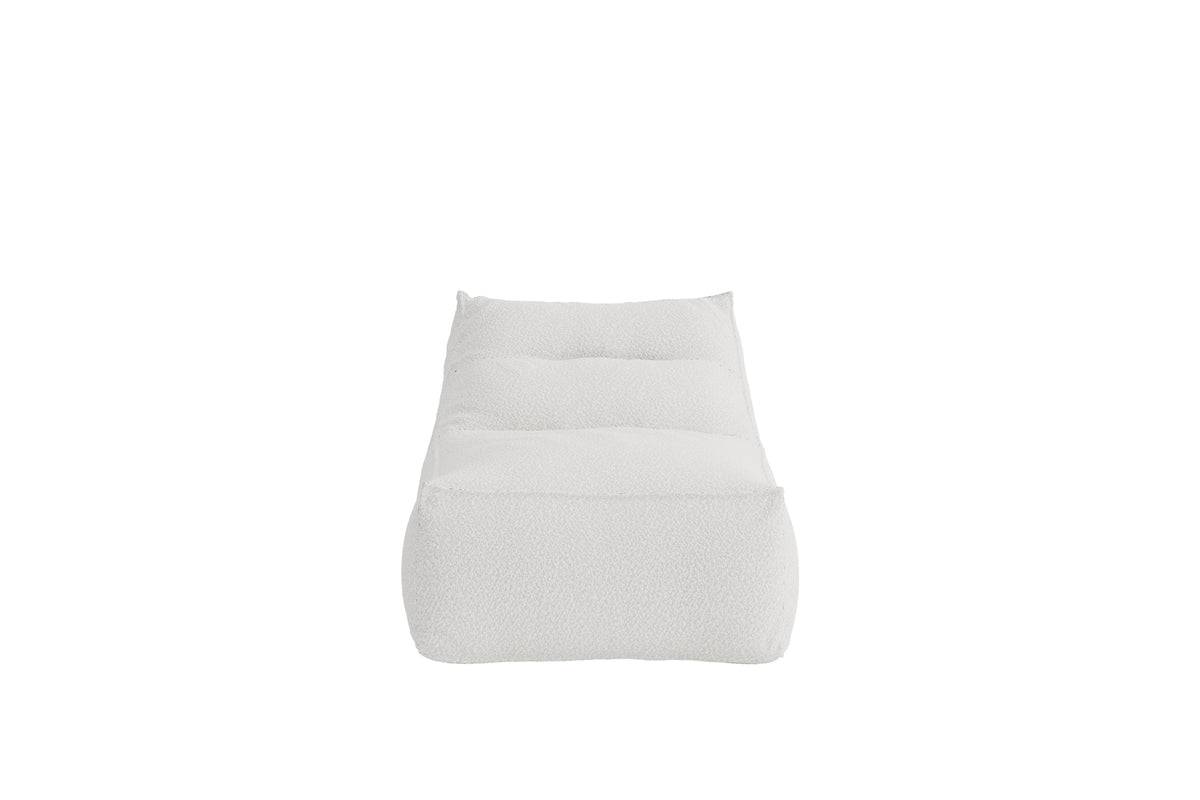 Minimalist white cushioned lounge chair featuring a tufted design and soft textured fabric, ideal for modern living spaces and relaxation. | PicSEO 1773145271301